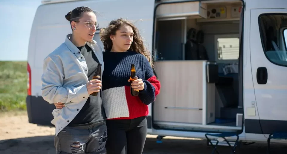 girls in front of an rv