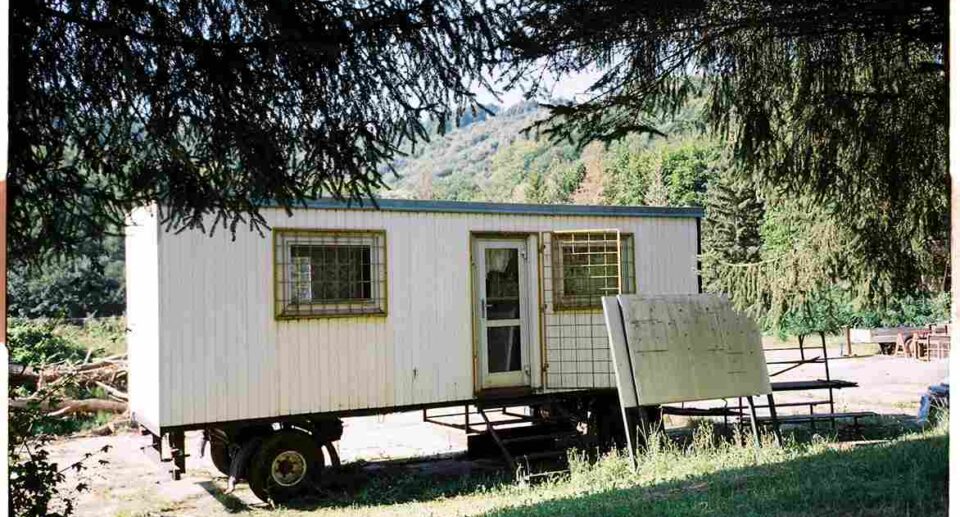 mobile home under a tree