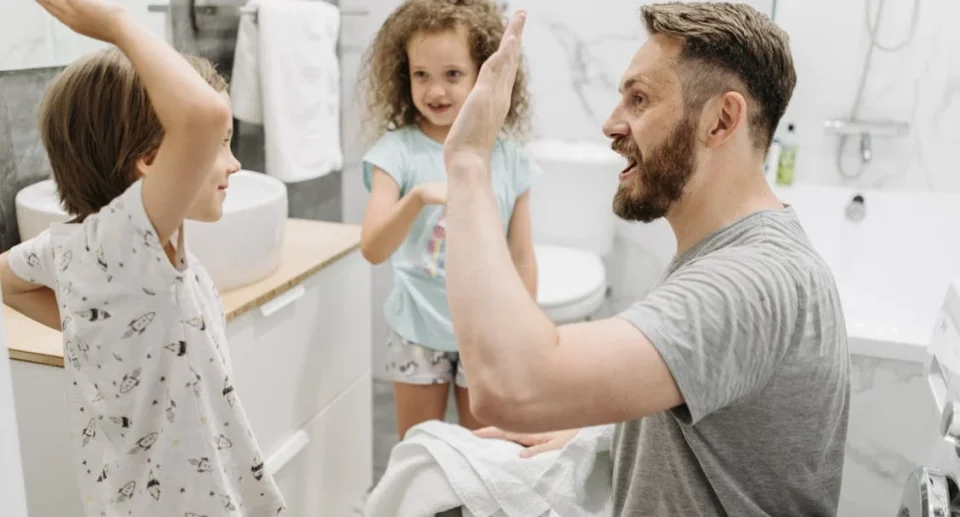 kids in bathroom with father