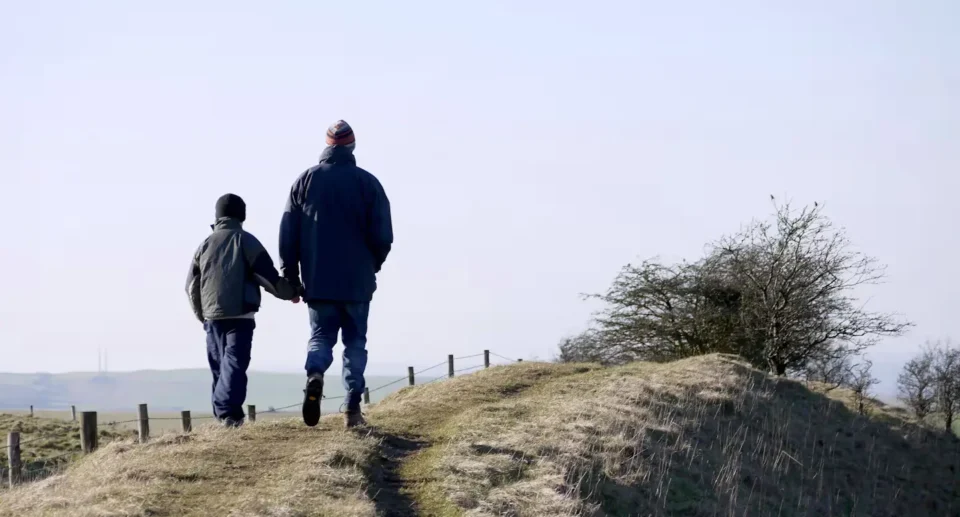 a father and a son trekking