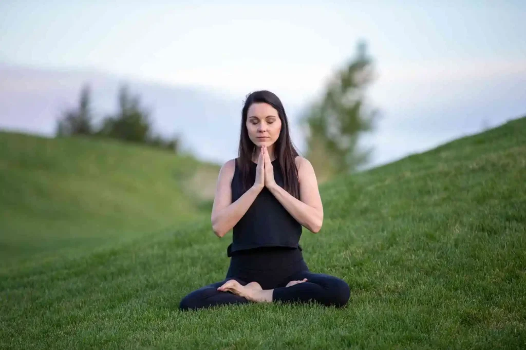 woman engaged in mindfulness and meditation to stop worrying