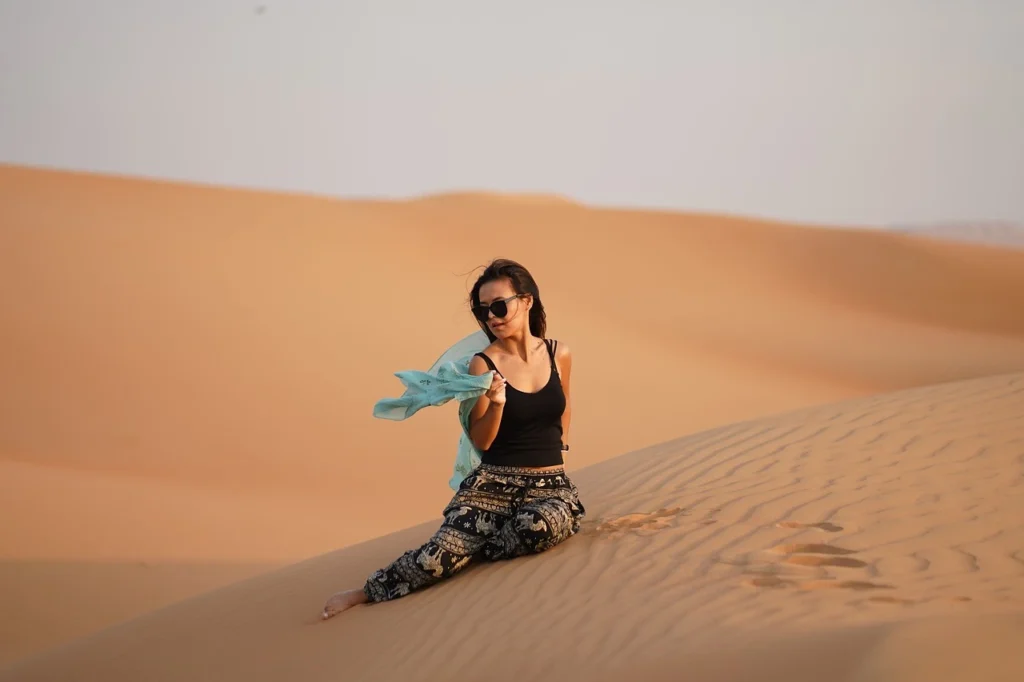 a girl enjoying in Dubai desert sand