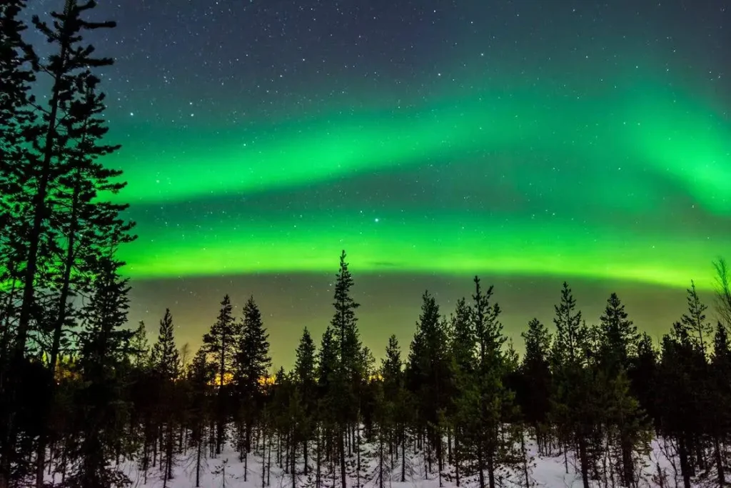 green aurora visible on sky in Lapland