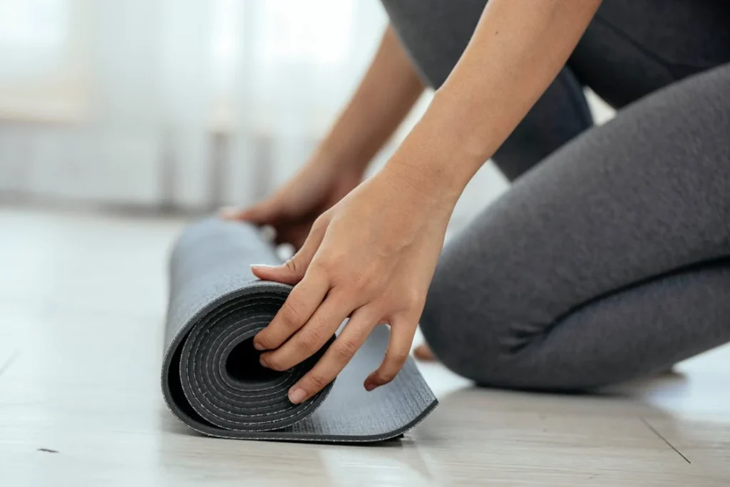 rolling a yoga mat.